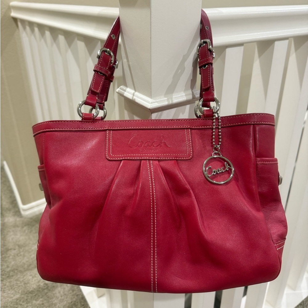 Fun red leather Coach purse with cute buckle details and contrast stitching